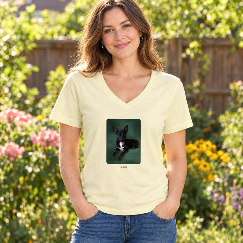 Lifestyle mockup: The V-Neck Tee worn in a garden, with our sample portrait